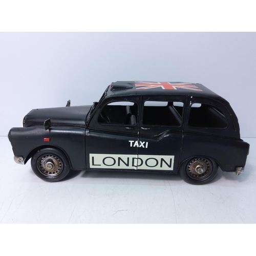 172 - Tin plate London taxi