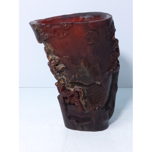 207 - Carved horn libation cup, 18cms in height