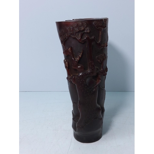 207 - Carved horn libation cup, 18cms in height