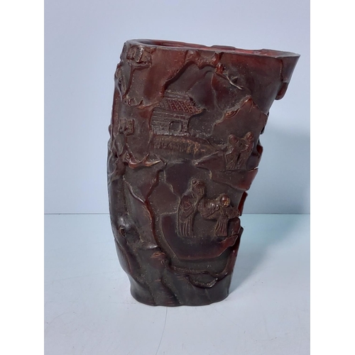 207 - Carved horn libation cup, 18cms in height