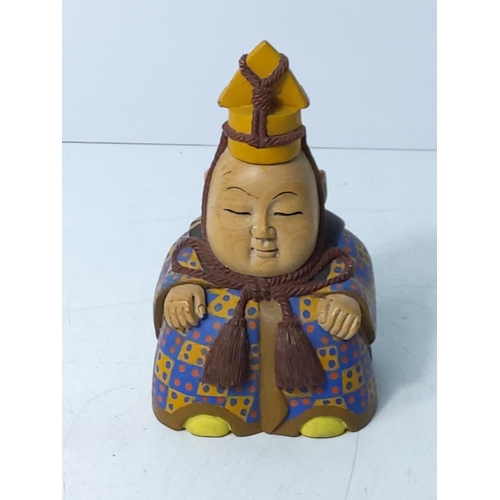 229 - Carved wooden oriental figure, 11cms in height