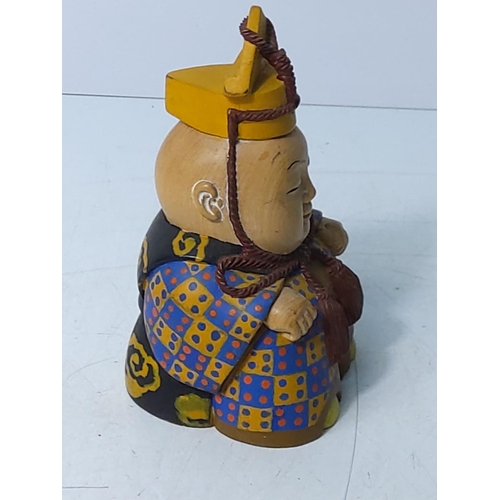 229 - Carved wooden oriental figure, 11cms in height