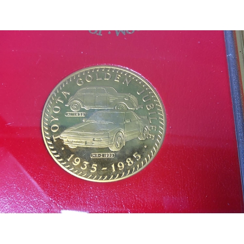 242 - Framed Toyota commemorative coin