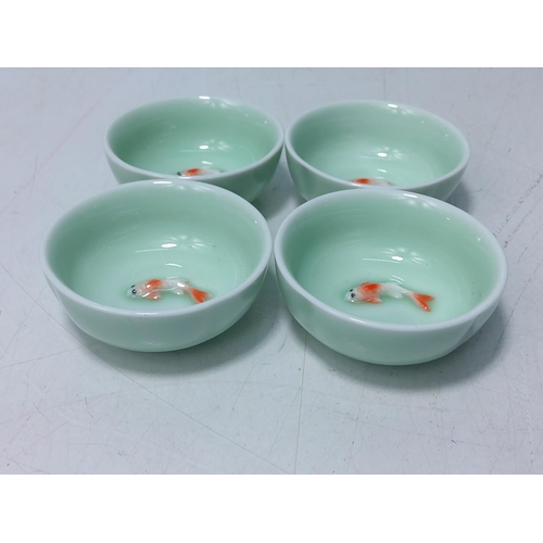 254 - 4 oriental porcelain bowls with koi fish, each being 7cms in diameter