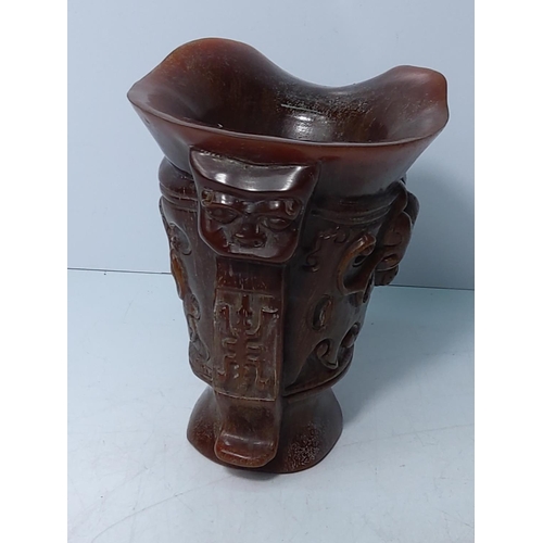 257 - Ornate carved horn libation cup, 13.5 x 13cms