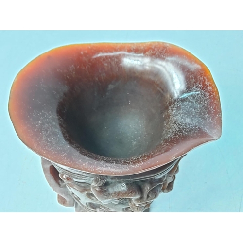 257 - Ornate carved horn libation cup, 13.5 x 13cms