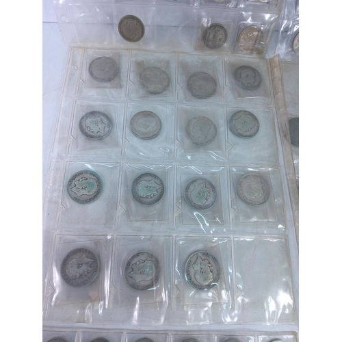 273 - 7 plastic leaves of coins including silver amnd half silver