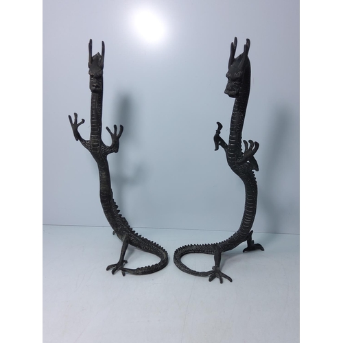 99 - Pair of cast bronze dragons, 40cms in height