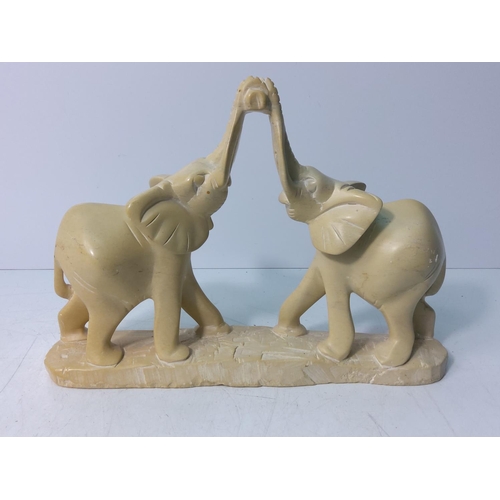 22 - Marble elephants, 27cms in length