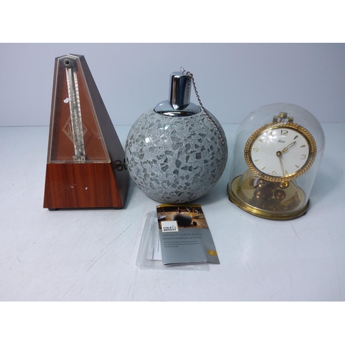 26 - Metronome, oil lamp and anniversary clock