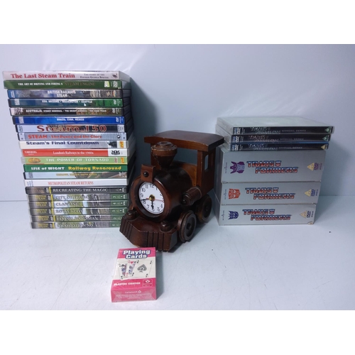 33 - Railway clock and DVD's, mainly train and Transformers related