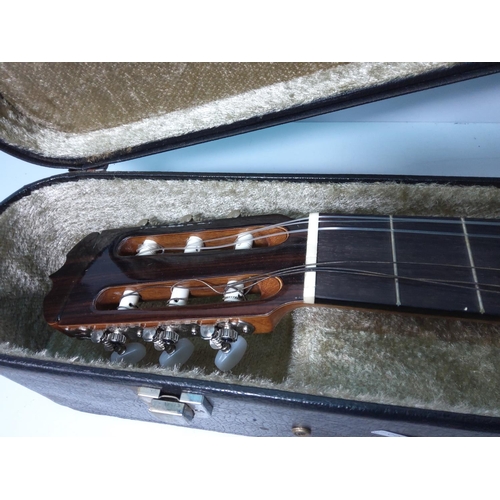 42 - Cased acoustic guitar