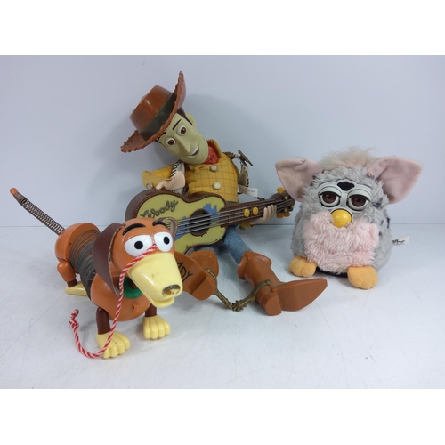 13 - Furby, 2 Toy Story figures and a boxed RC Dalek