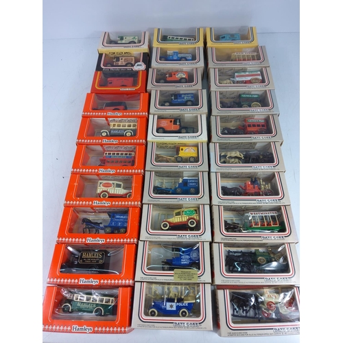 49 - 30 boxed model vehicles