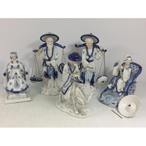 253 - Large qty of various blue and white figures, jugs and ornaments