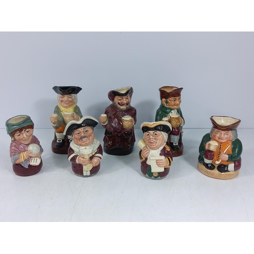 58 - 7 medium Doulton Toby jugs