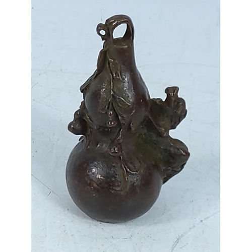 268 - Oriental cast bronze pendant