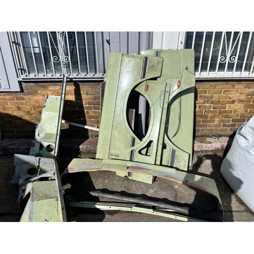 11 - Very large quantity of Classic Land Rover body panels including, quarter panels, wings, and other bo... 