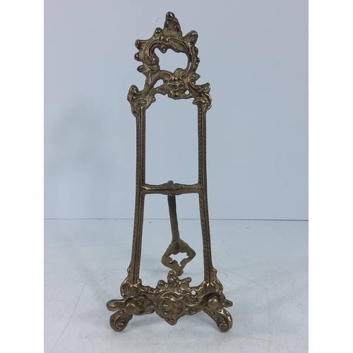 231 - Ornate brass easel, 42cms in height