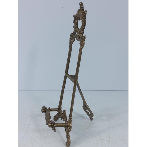 231 - Ornate brass easel, 42cms in height