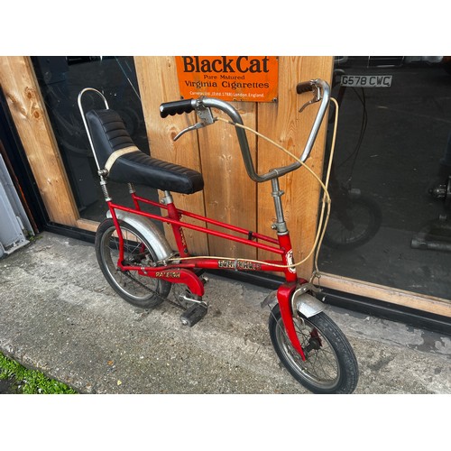 34 - Red Tomahawk cycle, in fair condition, needs a little tlc but good condition for its age. will make ... 