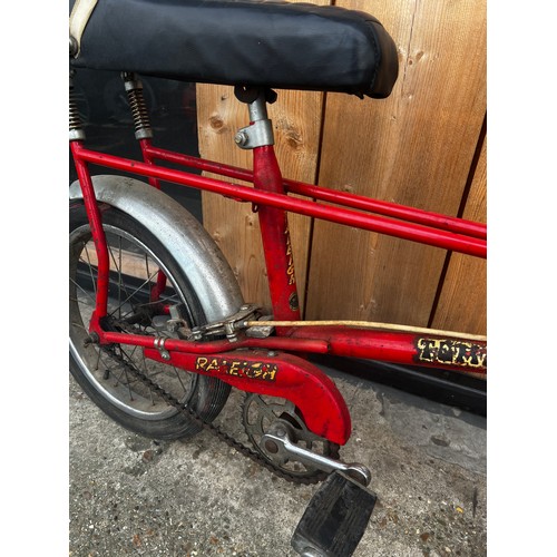 34 - Red Tomahawk cycle, in fair condition, needs a little tlc but good condition for its age. will make ... 