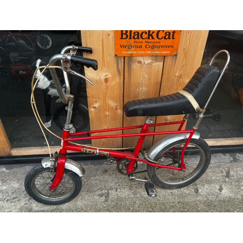 34 - Red Tomahawk cycle, in fair condition, needs a little tlc but good condition for its age. will make ... 