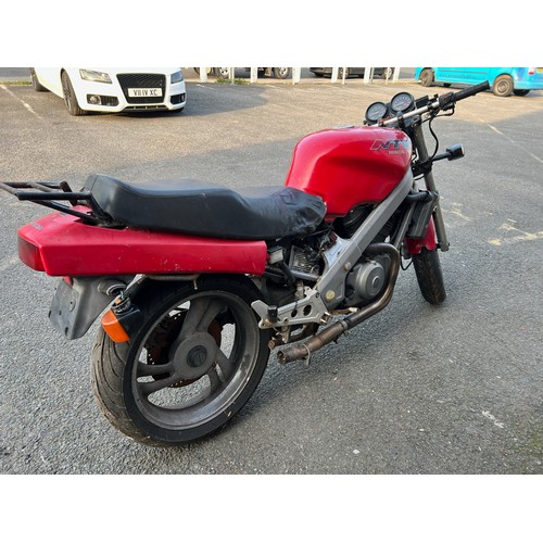 33 - Red Honda NTV registration P699TGN, 80485 miles on the clock this motorbike is a restoration piece, ... 