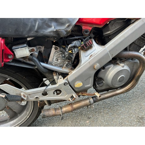 33 - Red Honda NTV registration P699TGN, 80485 miles on the clock this motorbike is a restoration piece, ... 