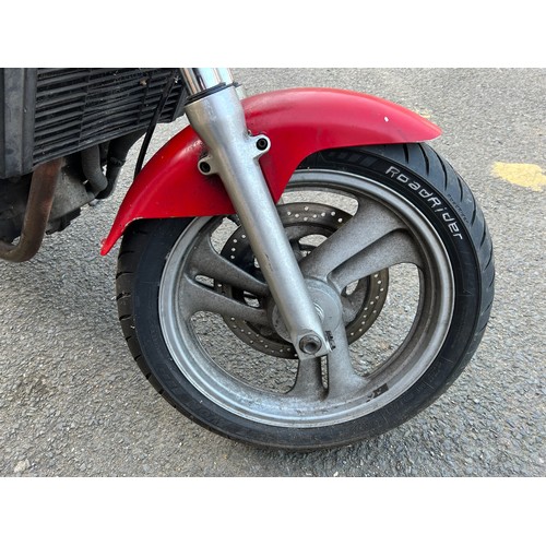 33 - Red Honda NTV registration P699TGN, 80485 miles on the clock this motorbike is a restoration piece, ... 