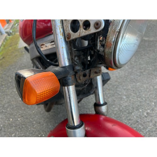 33 - Red Honda NTV registration P699TGN, 80485 miles on the clock this motorbike is a restoration piece, ... 