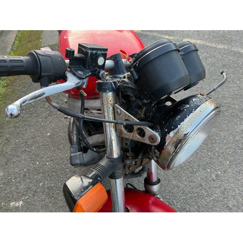 33 - Red Honda NTV registration P699TGN, 80485 miles on the clock this motorbike is a restoration piece, ... 