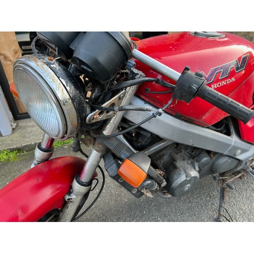 33 - Red Honda NTV registration P699TGN, 80485 miles on the clock this motorbike is a restoration piece, ... 