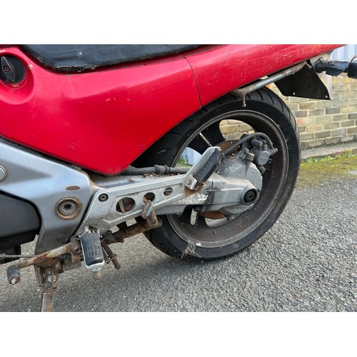 33 - Red Honda NTV registration P699TGN, 80485 miles on the clock this motorbike is a restoration piece, ... 