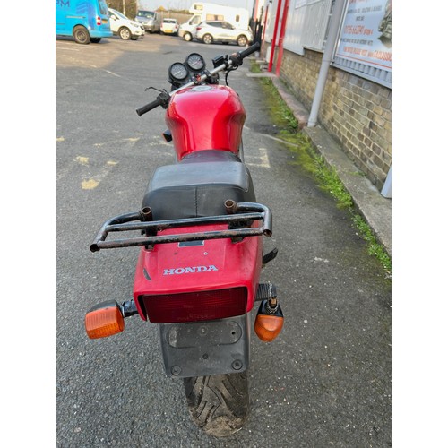 33 - Red Honda NTV registration P699TGN, 80485 miles on the clock this motorbike is a restoration piece, ... 