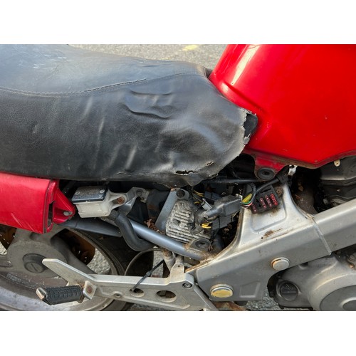 33 - Red Honda NTV registration P699TGN, 80485 miles on the clock this motorbike is a restoration piece, ... 