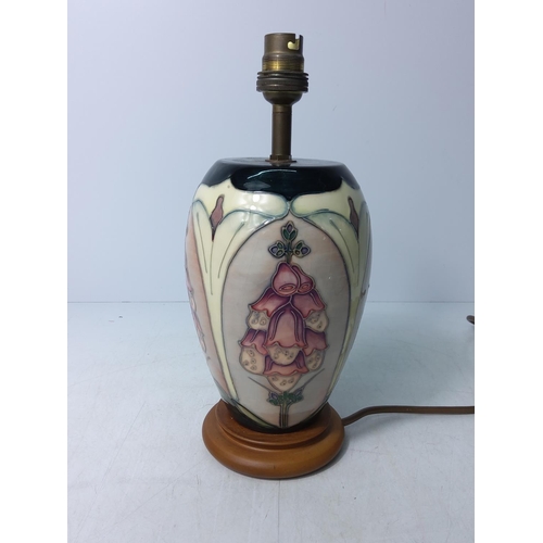 155 - Floral decorated Moorcroft lamp, 28cms in height