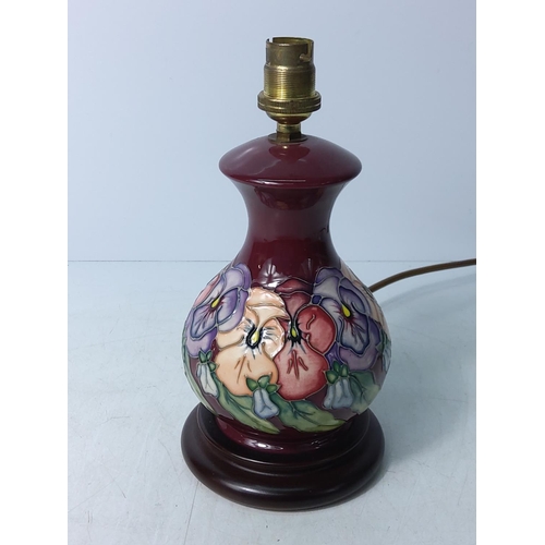 156 - Floral decorated Moorcroft lamp, 24cms in height