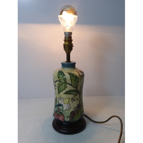 157 - Floral decorated Moorcroft lamp, 32cms in height