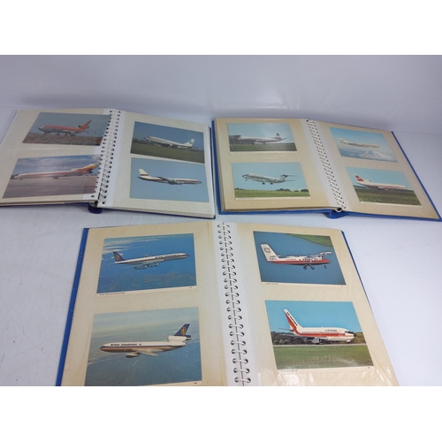 162 - 4 albums of military aircraft postcards and 3 albums of commercial aircraft postcards