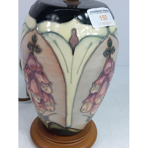 155 - Floral decorated Moorcroft lamp, 28cms in height