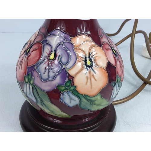 156 - Floral decorated Moorcroft lamp, 24cms in height