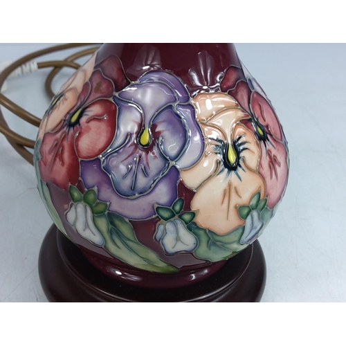 156 - Floral decorated Moorcroft lamp, 24cms in height