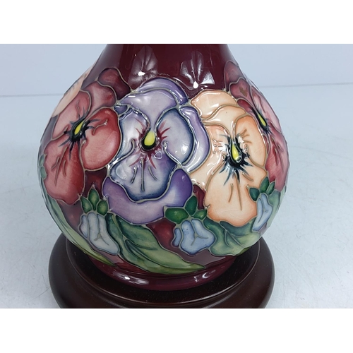 156 - Floral decorated Moorcroft lamp, 24cms in height