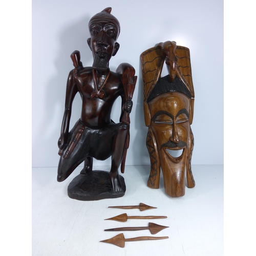 179 - Large carved hardwood tribal figure and a tribal mask