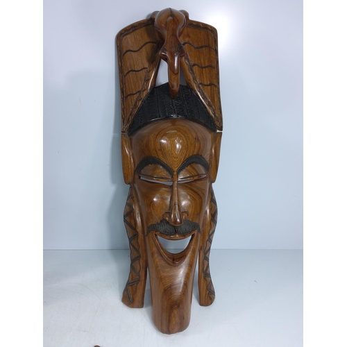 179 - Large carved hardwood tribal figure and a tribal mask