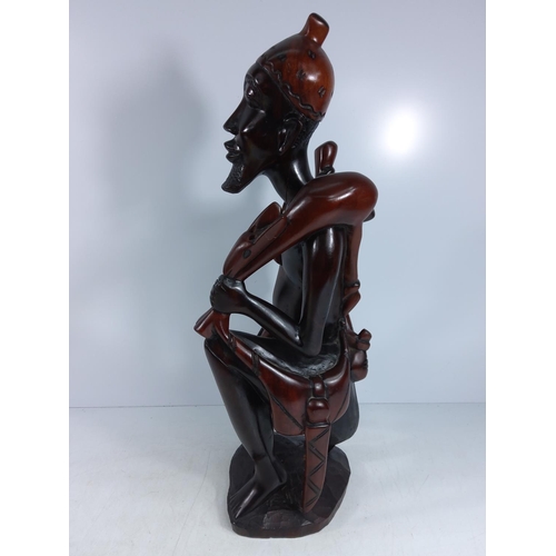 179 - Large carved hardwood tribal figure and a tribal mask