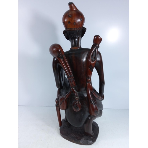 179 - Large carved hardwood tribal figure and a tribal mask