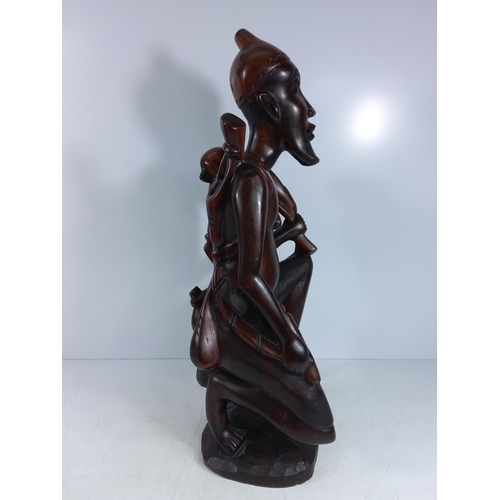 179 - Large carved hardwood tribal figure and a tribal mask