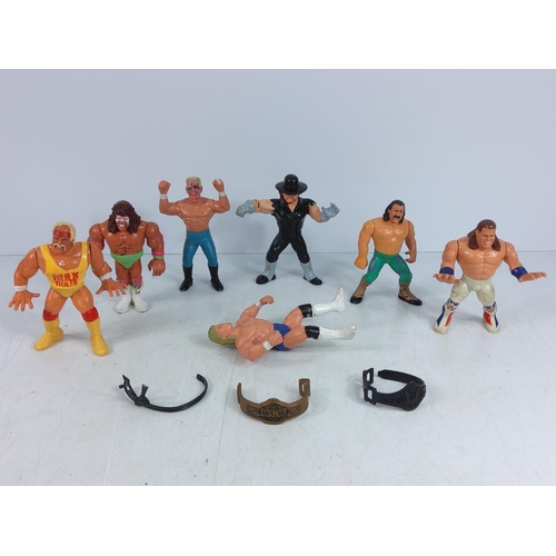 206 - Box of wrestlers and action figures including Ghostbuster characters, He-Man & Battle Cat, The Simps... 